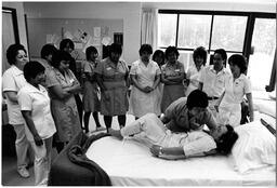 Nurses-in-training watching demonstration