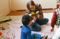 Child blowing air into mouth