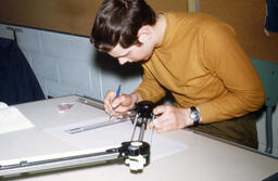 Student at a drafting board
