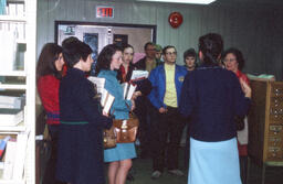 Students standing with books