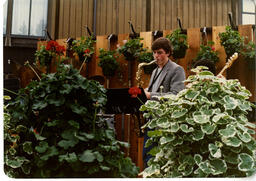 Man playing saxophone during graduation