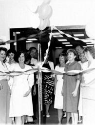 Ribbon cutting for new library security system.