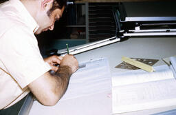 Student working at a drafting board