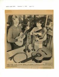 Kelly Burke and Nancy McMaster with donated instruments